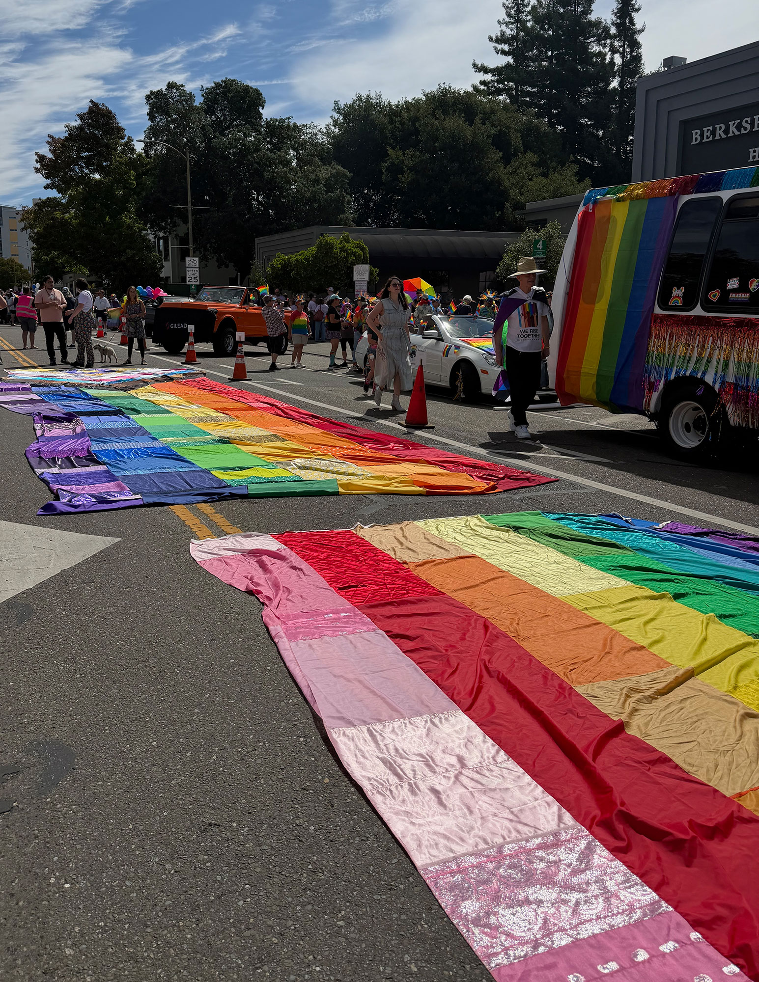 Rainbow banners laid out on the street before the Pride Parade